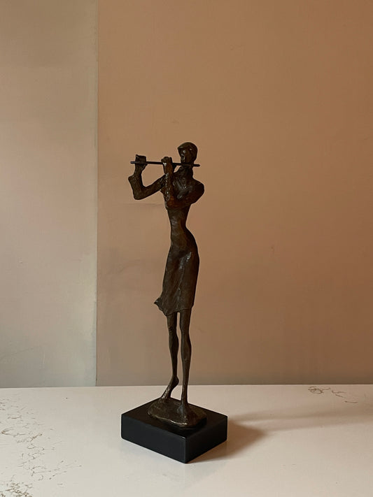 Sculpted Bronze Flutist in Windswept Dress on Black Podium